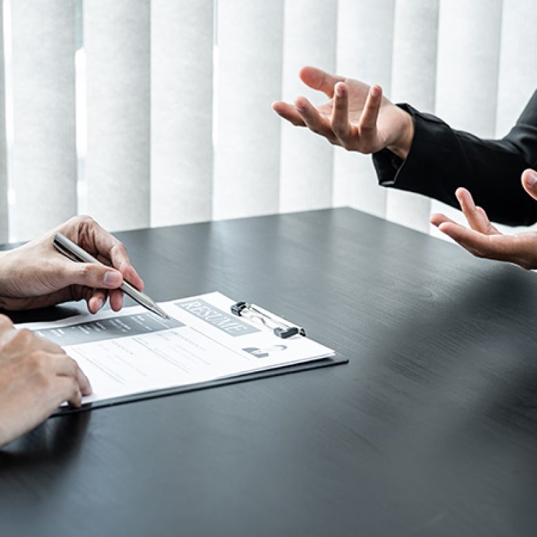 Young married couple carrying cardboard box in front of their new home on moving day Young married couple carrying cardboard box in front of their new house on moving day