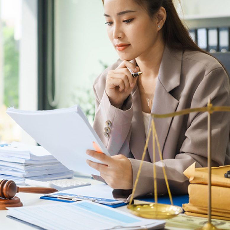 Young married couple carrying cardboard box in front of their new home on moving day Young married couple carrying cardboard box in front of their new house on moving day